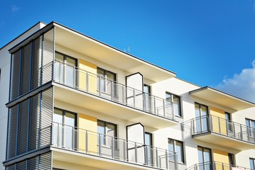 Modern apartment buildings on a sunny day with a blue sky. Facade of a modern apartment building.