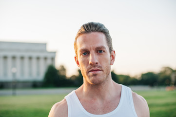 Handsome Caucasian man portrait while resting during a workout outdoors at the National Mall in Washington DC - 313155147