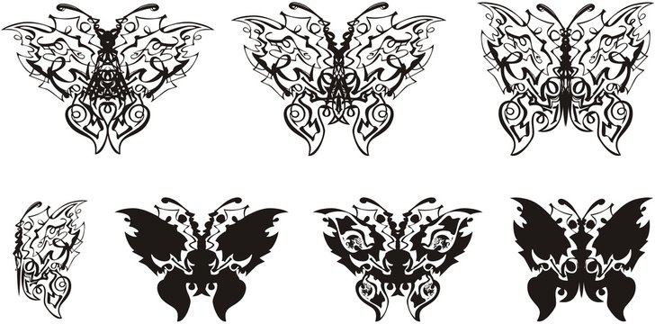 Linear butterfly symbols tattoo art. Beautiful unusual silhouettes of ethnic butterflies with floral patterns inside for your design. Black on White