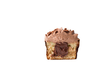 Half a cupcake with chocolate cream, inside with caramel.