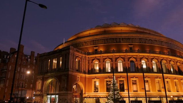 Twilight establishing shot of the Royal Albert Hall in London, England, UK, a concert hall opened by Queen Victoria in 1871