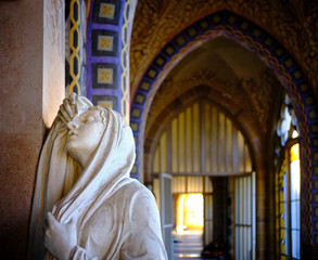 Close up of a mourning woman sculpture in the corridors of Campo Santo, a grave building on the...