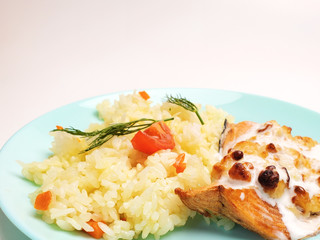 Fried fish steak with seasoned rice. fish fillet with rice.