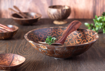 Eco friendly tableware from natural materials: wooden bowls, spoons, fork. Environmentally friendly wooden tableware. Zero waste concept.