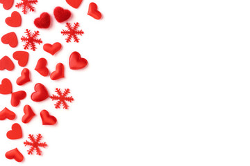 Festive composition from red hearts and snowflakes scattered and isolated on white background, valentines day concept