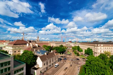 Keuken spatwand met foto Skyline and cityscape of road with car transport on Museumstrasse in Vienna of Austria. Wien in Europe. Panorama. Street view. Building architecture landmark. In summer. Blue sky with clouds. © Roman Babakin