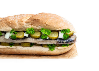 Traditional Dutch sandwich with herring and pickles isolated on white