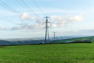 electricity pylons in a field