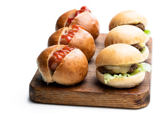Set of three mini hamburgers and hotdogs isolated on white background