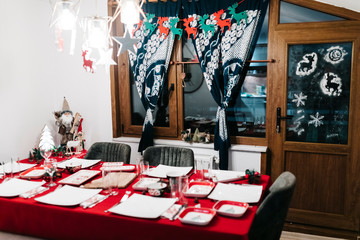 Christmas dinner table with traditional Turkish Cuisine food and red new year concept. 