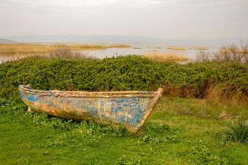 Old ruined boat and lake