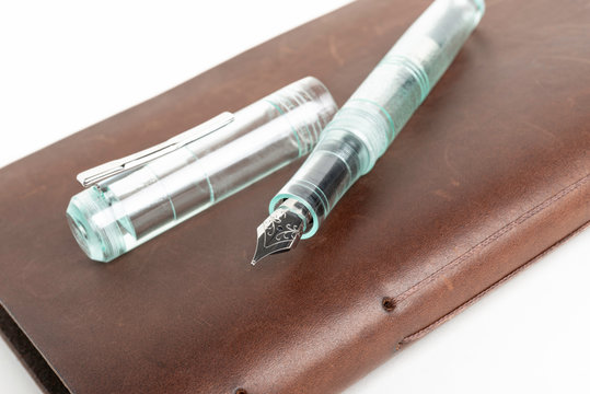 Brown Leather Journal And Green Glass Fountain Pen