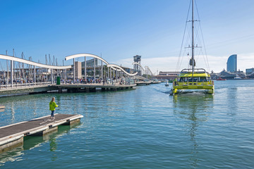 Port Vell with catamaran, Maremagnum, tower Torre Sant Sebastia and W Barcelona