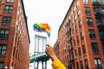 Hand waving LGBT flag in NYC