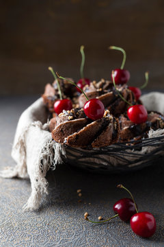 Basket of German minigugelhupf cakes with chocolate, brittle and cherries