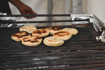 Grilling food in kitchen
