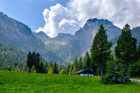 Scenic view of secluded Hintere Langentalalm cafe with Benediktenwand ridge in background