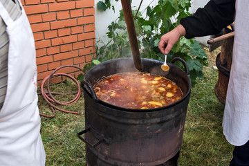 Cooking stew in the cauldron