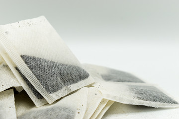 Heap of tea bags isolated on white background