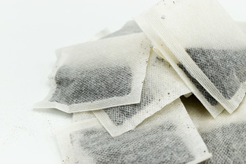 Heap of tea bags isolated on white background