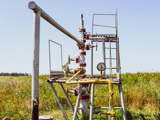Well for oil and gas production. Oil well wellhead equipment. Oil production