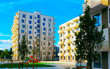 Apartment in residential building exterior. Housing structure at blue modern house of Europe. Rental home in city district on summer. Architecture for business property investment, Vilnius, Lithuania.