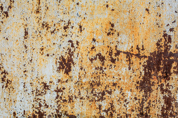 texture of an old rusty sheet of metal painted with white paint burnt out in the sun