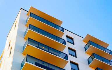 Apartment in residential building exterior. Housing structure at blue modern house of Europe....