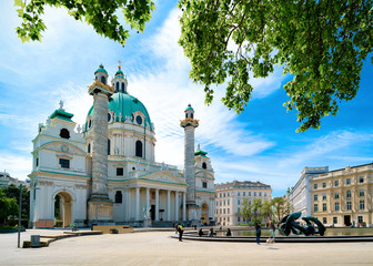 Fototapeta na wymiar Karlskirche Cathedral, or St. Charles Church on Karlsplatz in Old city center in Vienna of Austria. Wien in Europe. Panorama, cityscape of baroque roman catholic temple. Austrian town history