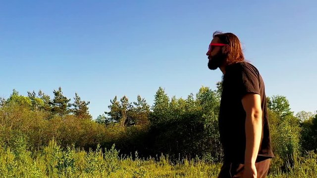 men with long hair walking by in slow motion
