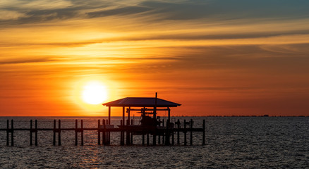 Fototapeta na wymiar Sunset over a pier in Florida 