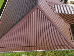 A view from above on the roof of the house. The roof of corrugated sheet. Roofing of metal profile wavy shape