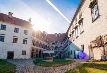 Building architecture and courtyard of Ptuj Castle in Slovenia. Facade of Ptujski grad in Slovenija. Sunset