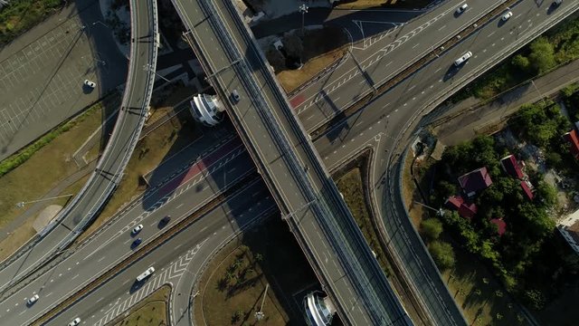 Flight lifting high road junction multilevel highway Sochi Adler modern cityscape overpass track expressway intersection. Active traffic vehicles transport. Christian church saved miraculous image