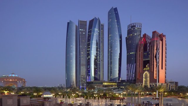 Etihad Towers viewed over the fountains of the Emirates Palace Hotel, Abu Dhabi, United Arab Emirates, Middle East