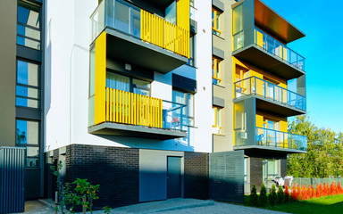 Apartment in residential building exterior. Housing structure at blue modern house of Europe....