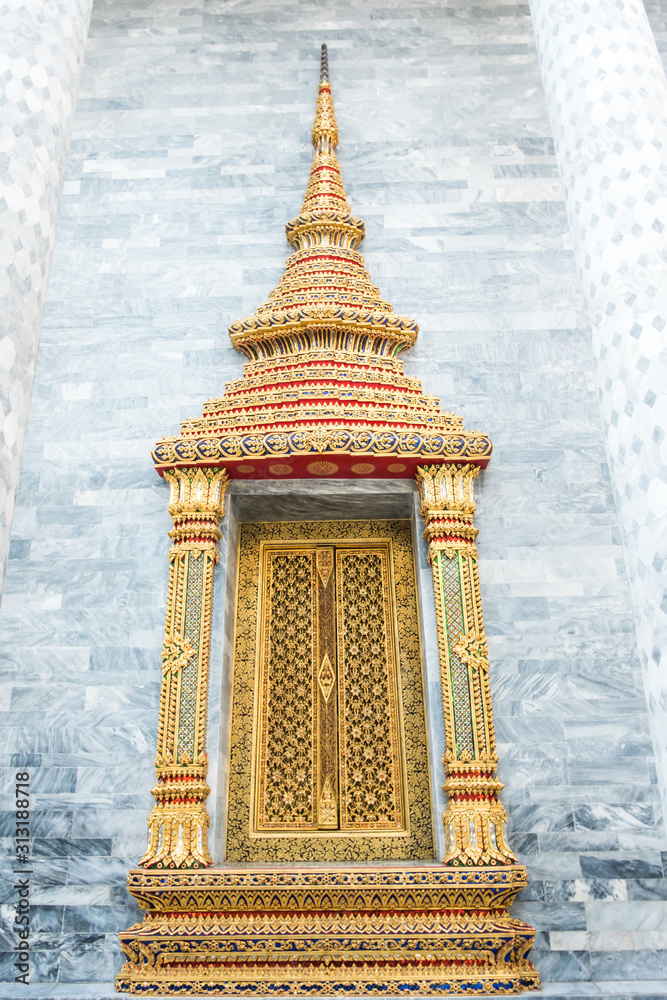 Wall mural The beautiful of temple thai style windows. Gold historic window at temple.