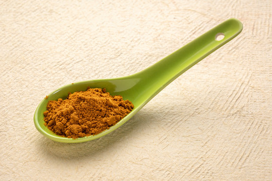 turmeric root powder on spoon