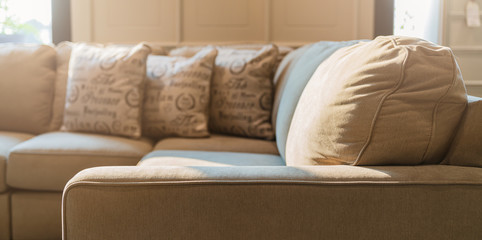 close up of soft fabric pillow decoration on beautiful sofa in living room home design concept