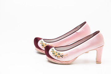 Korean traditional flower shoes on a white