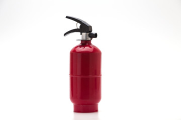 Red fire extinguisher on white background