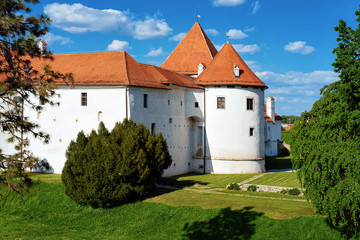 Fototapeta na wymiar View of Castle at Street at Old city of Varazdin in Croatia. Panorama and Cityscape of famous Croatian town in Europe in summer. Travel and tourism for tourists.