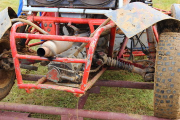 Buggy car exhaust pipe silencer on red frame rear view close up, auto cross race