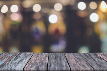 Wooden table in front blurred vintage background, use for product, advertising 