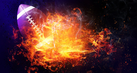 Burning rugby ball on dark background © Pixel-Shot
