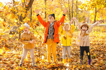 Cute little children having fun in autumn park