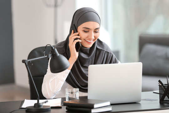 Beautiful Arab businesswoman working in office