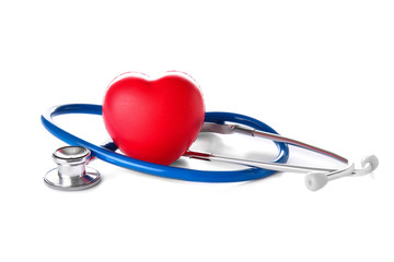 Stethoscope and heart on white background