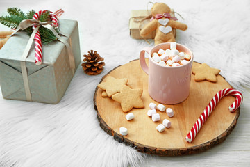 Beautiful Christmas composition with hot chocolate on light background