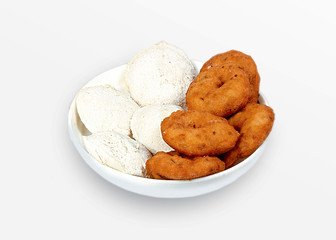 Group of South Indian food like Paper Masala Dosa (dhosa), Idli or idly, Wada or vada (Medu Vada), sambhar, sambar and coconut chutney, white background.